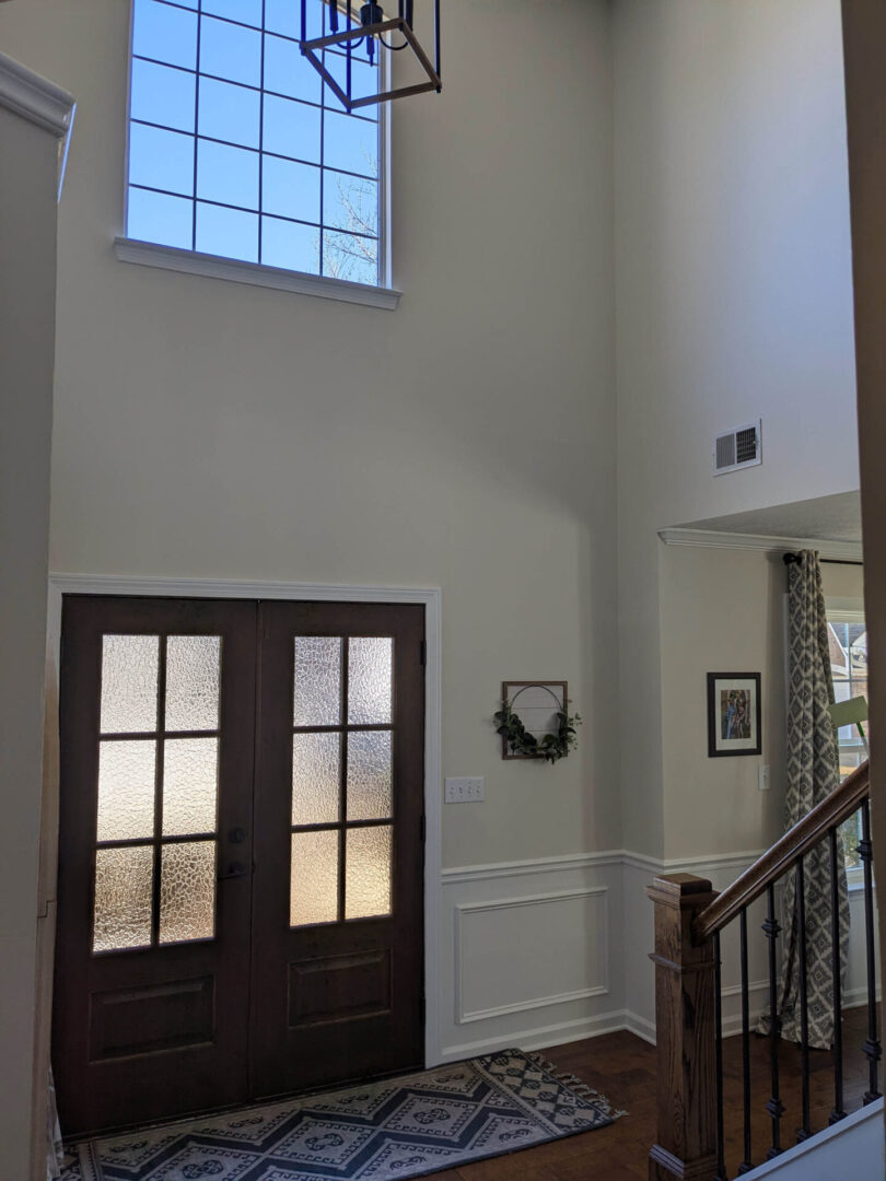 A large open door leading to the foyer of a house.